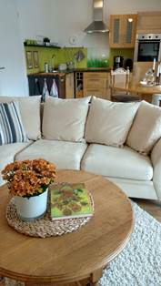 Ferienwohnung "Am Park" - Wohnraum mit Sitzecke