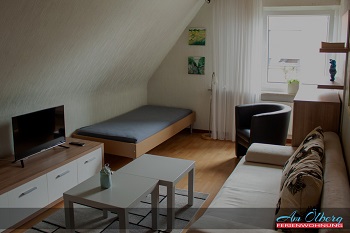 Ferienwohnung Ripper Wohnzimmer mit Bett